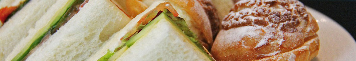 Eating Breakfast & Brunch Sandwich at Handy's Lunch restaurant in Burlington, VT.